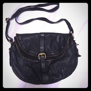 Genuine black leather with brass accents crossbody